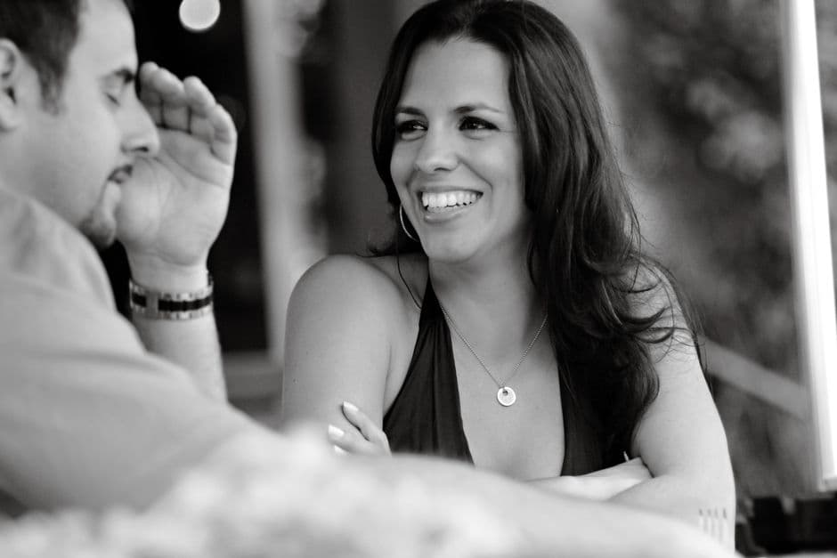 Two people in honest conversation at a cafe table